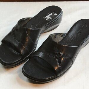 CLARK’S SLIP ON BLACK SANDALS, size 7M.